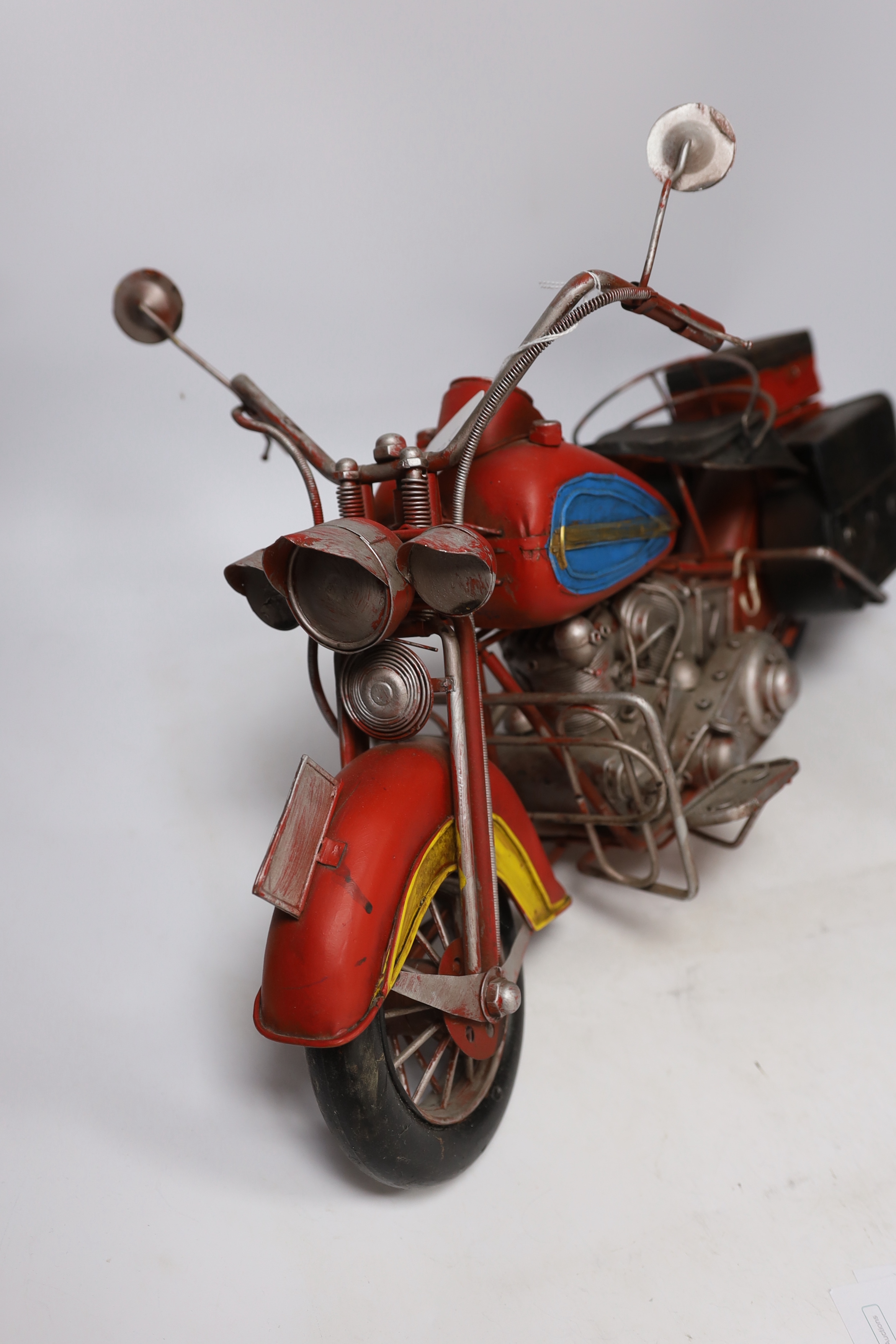 A faux tinplate motorcycle, 54cm long